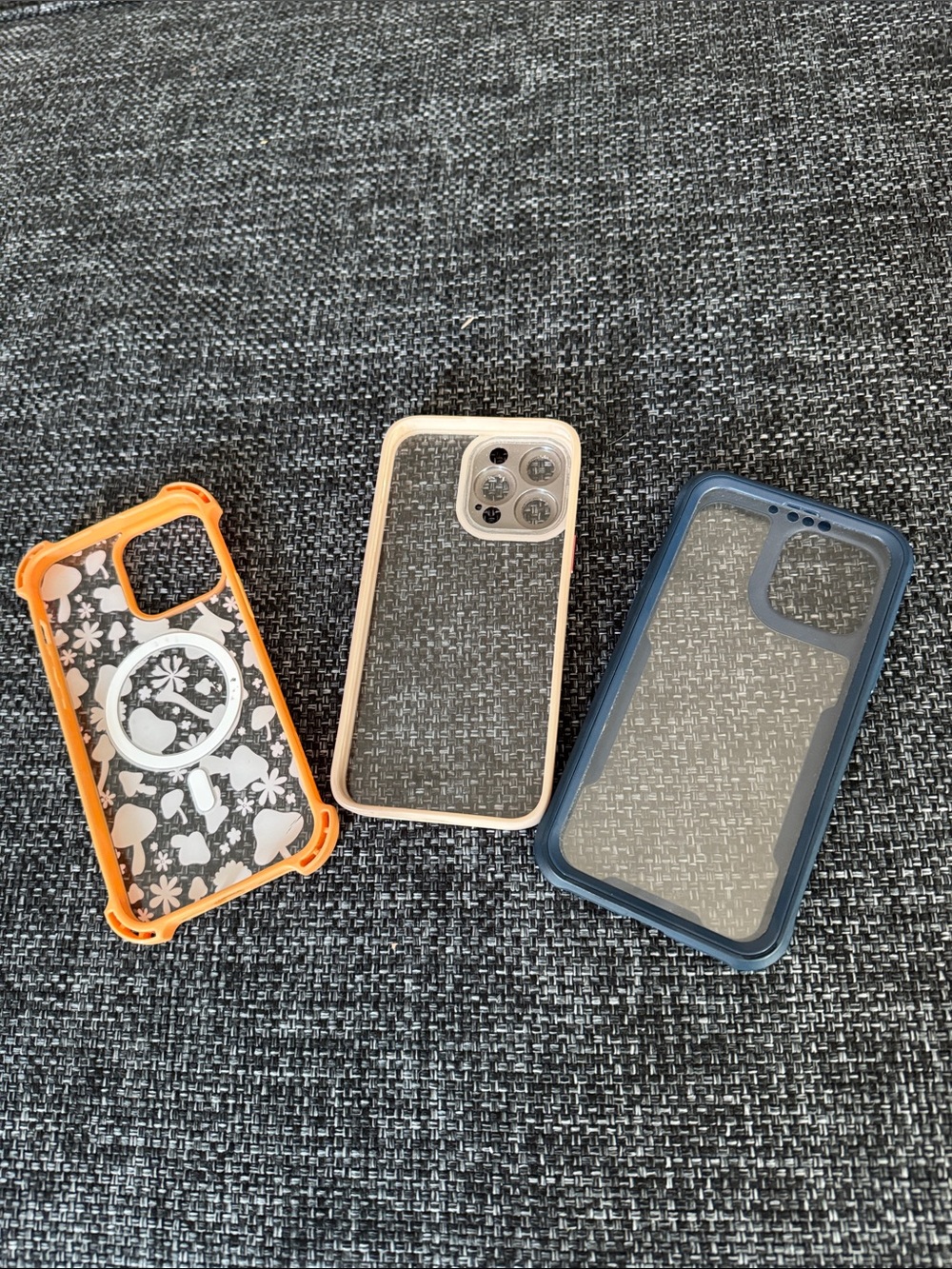 Clear Protective IPhone Case with Orange, Beige, and Blue Accent Bumpers